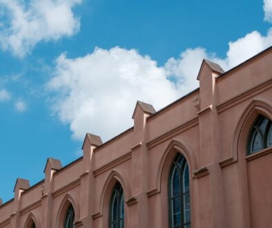 a building with a a building with a clock on the front of it